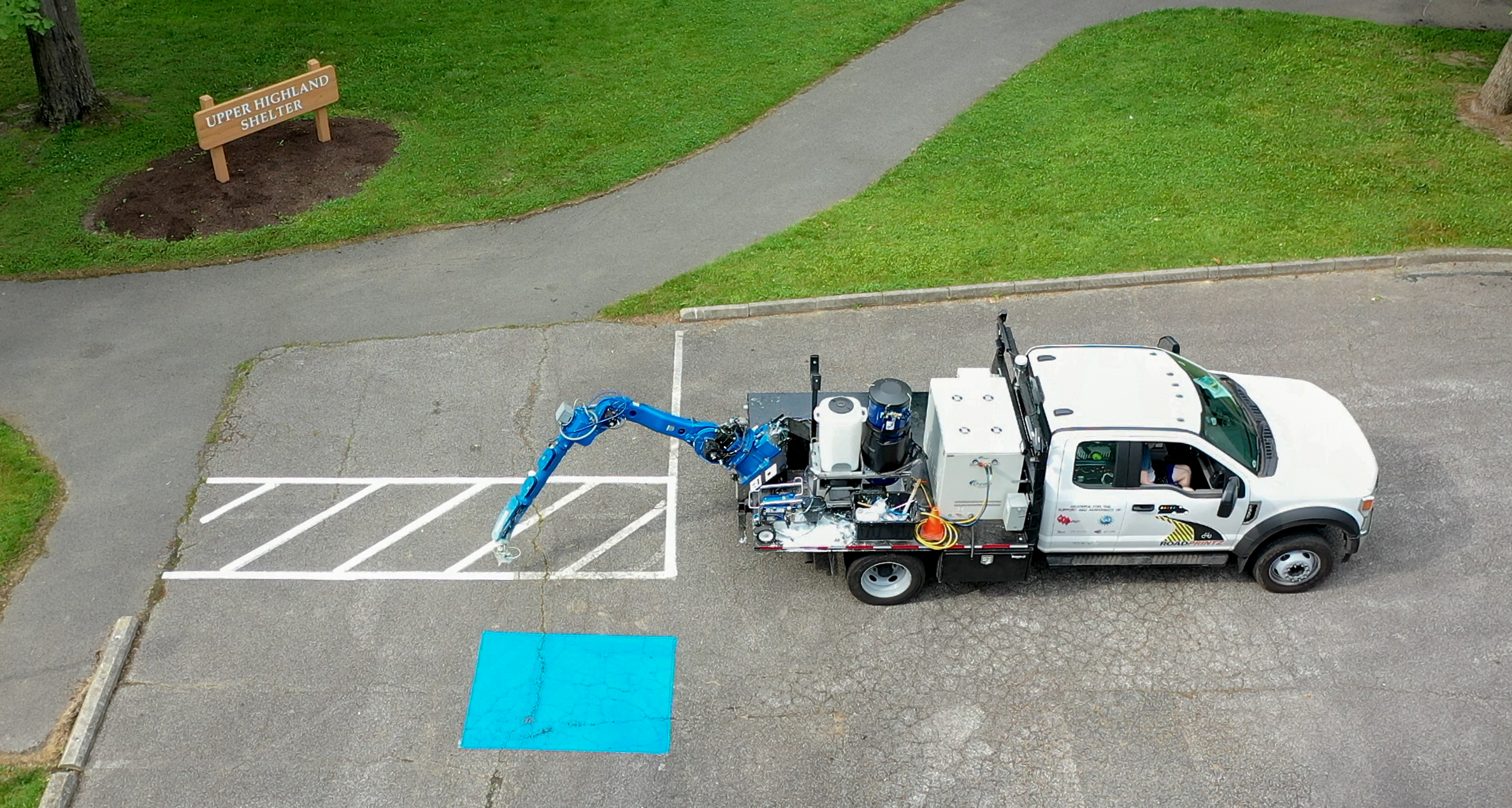 Robotic marking robot; handicap parking symbol; precision repainting